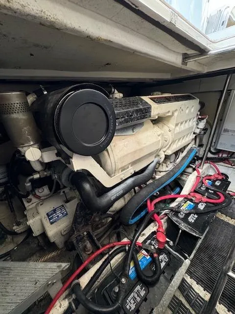 Slide: The Image of Engine compartment of a 2000 Formula 41 PC boat with visible wiring and components. - 42