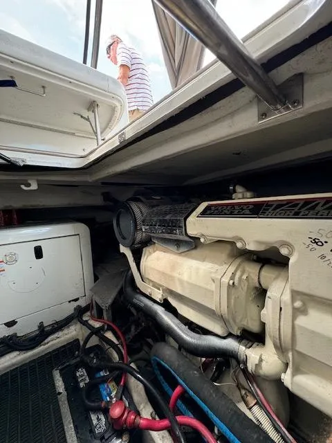 Slide: The Image of Engine compartment of a 2000 Formula 41 PC boat with visible components. - 46