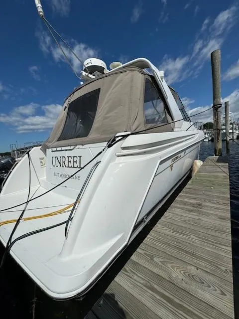 Slide: The Image of 2000 Formula 41 PC boat docked at marina under blue sky. - 5
