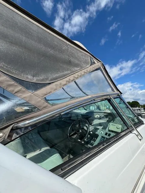 Slide: The Image of 2000 Formula 41 PC boat with clear canopy and steering wheel, under a blue sky. - 6