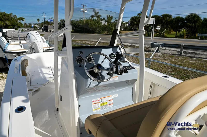 Slide: The Image of 2024 Bayliner T20 boat interior with steering wheel and control panel. - 13