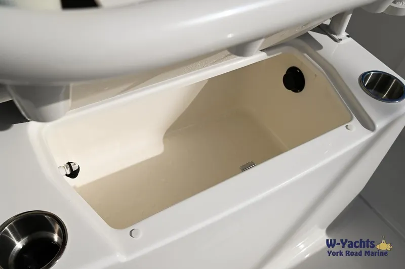 Slide: The Image of 2024 Bayliner T20 boat storage compartment with cup holders. - 19