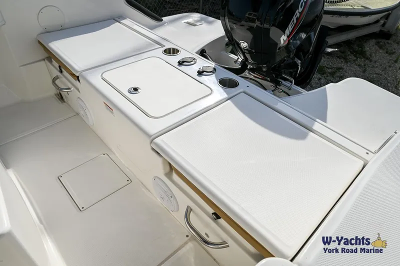 Slide: The Image of 2024 Bayliner T20 boat deck with seating and Mercury outboard motor. - 20