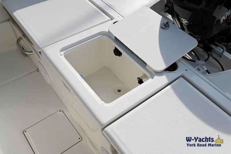 Slide: The Image of 2024 Bayliner T20 boat storage compartment and seating area. - 22