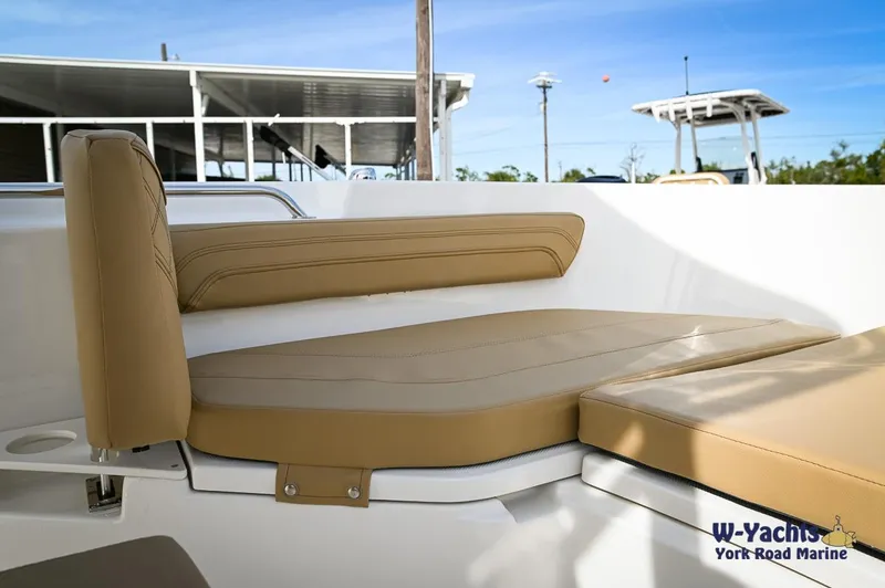 Slide: The Image of 2024 Bayliner T20 boat with tan cushioned seating. - 8