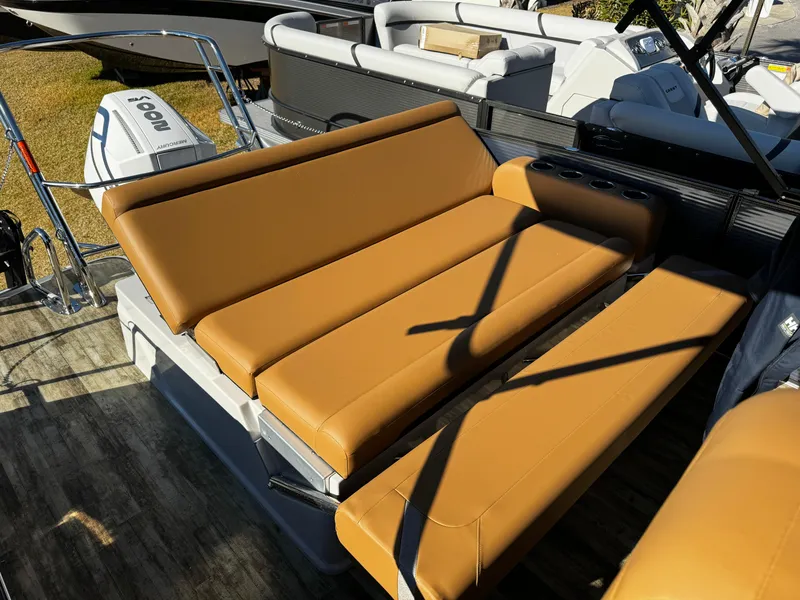Slide: The Image of 2024 Crest Caribbean LX 230 boat with tan leather seating. - 3