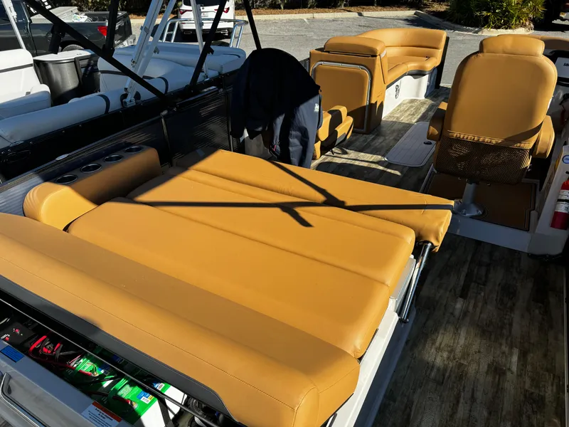 Slide: The Image of 2024 Crest Caribbean LX 230 boat interior with tan leather seating and modern design. - 5