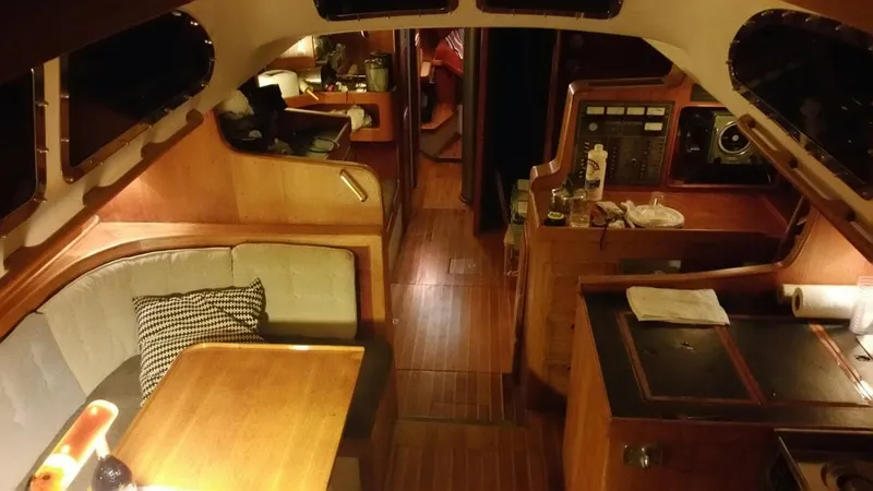 Slide: The Image of Interior of 1967 Columbia Yacht 50 with wooden furnishings and cozy seating area. - 13