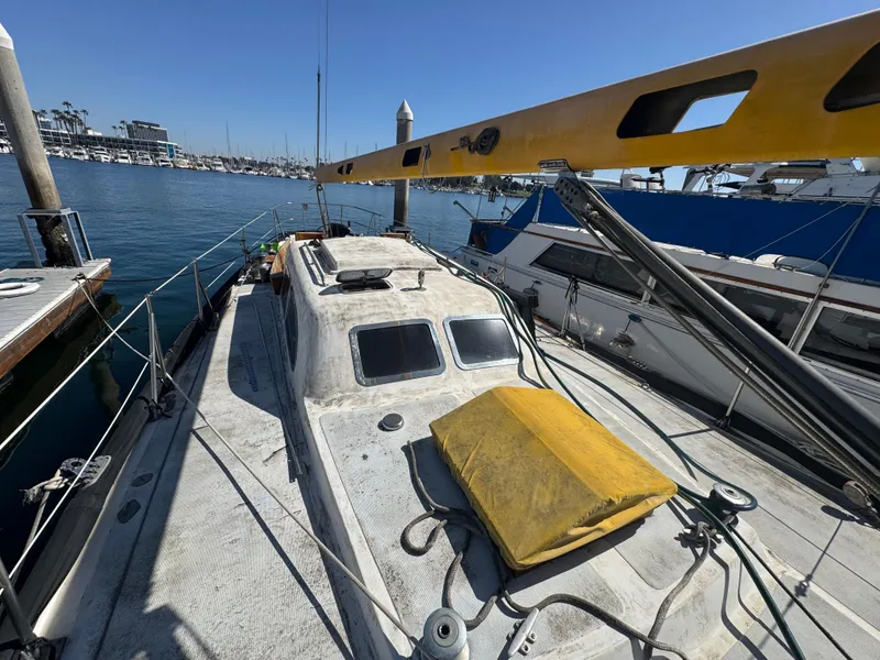 Slide: The Image of 1967 Columbia Yacht 50 docked at marina, sunny day, visible deck and mast. - 2