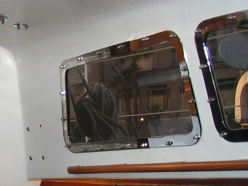 Slide: The Image of Close-up of 1967 Columbia Yacht 50 window with exterior reflection. - 22