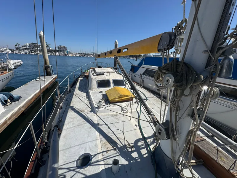Slide: The Image of 1967 Columbia Yacht 50 docked at marina, sunny day, clear blue sky. - 31