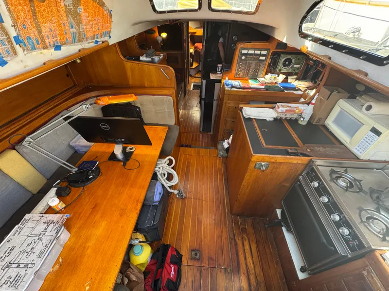 Slide: The Image of Interior of 1967 Columbia Yacht 50 with wooden furnishings and modern amenities. - 34