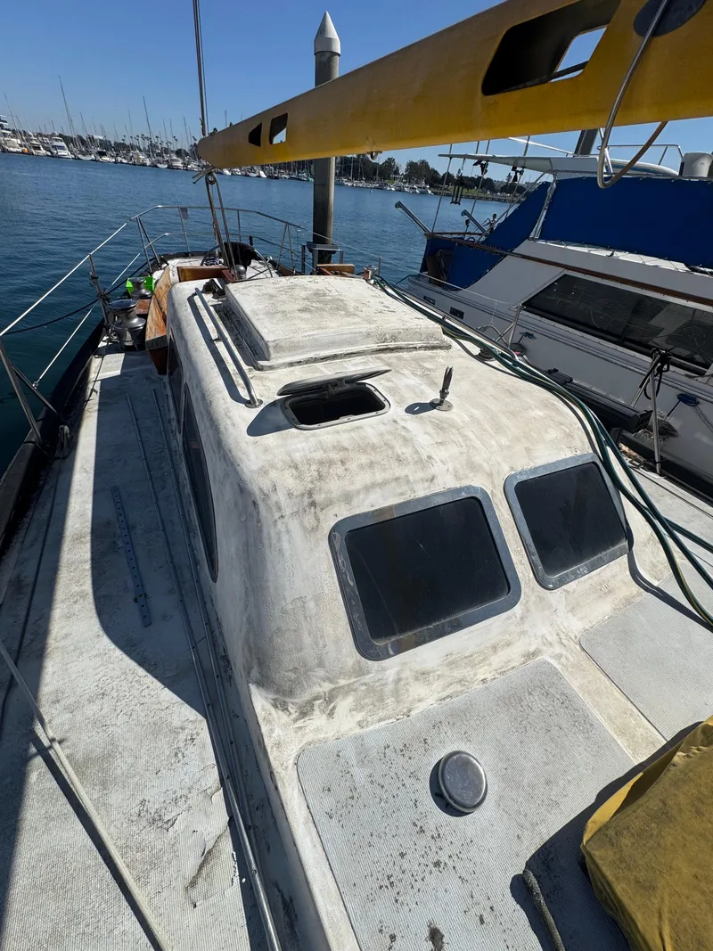 Slide: The Image of 1967 Columbia Yacht 50 docked, showing cabin and deck details. - 38