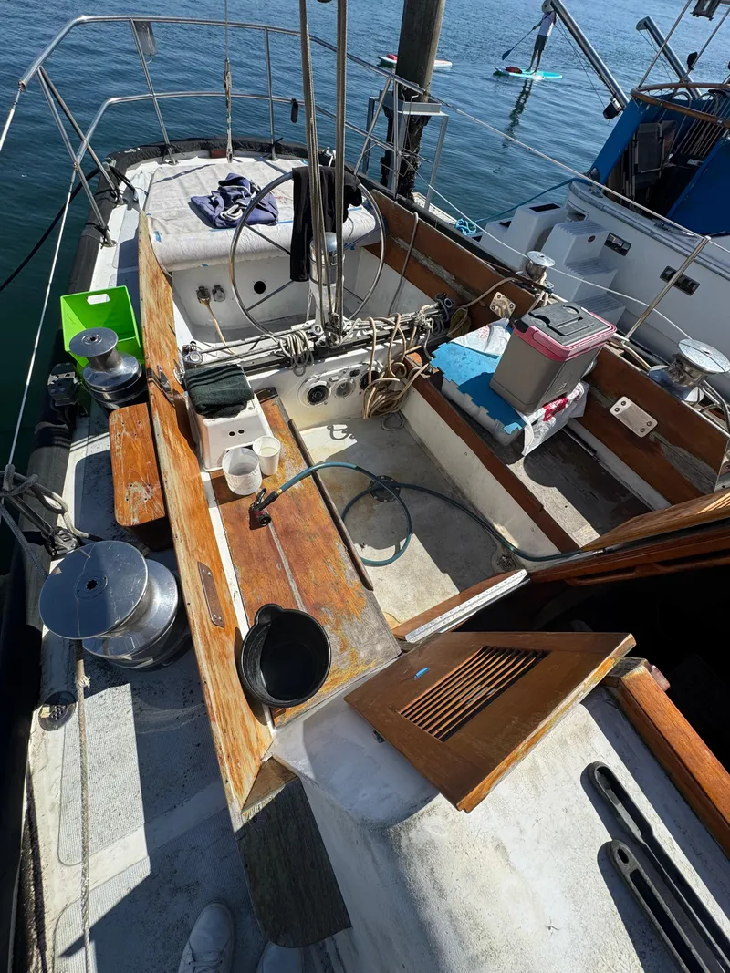 Slide: The Image of 1967 Columbia Yacht 50 cockpit with wooden accents and nautical equipment. - 39
