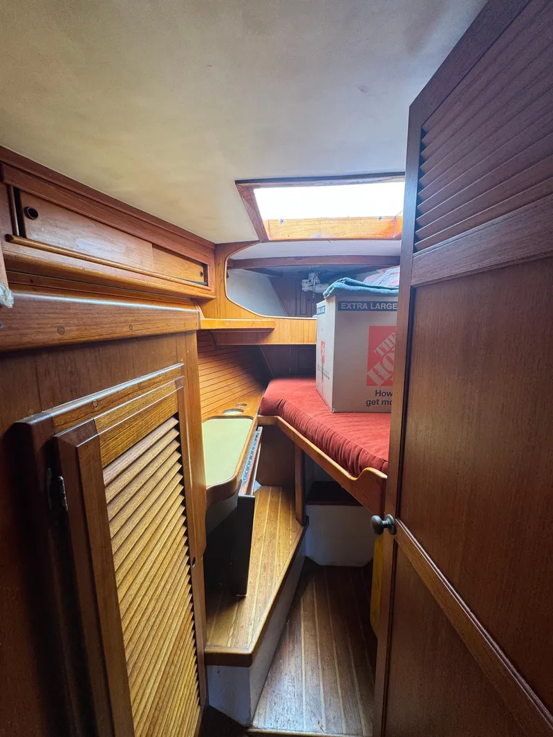 Slide: The Image of Interior of 1967 Columbia Yacht 50 with wooden cabinetry and a skylight. - 47