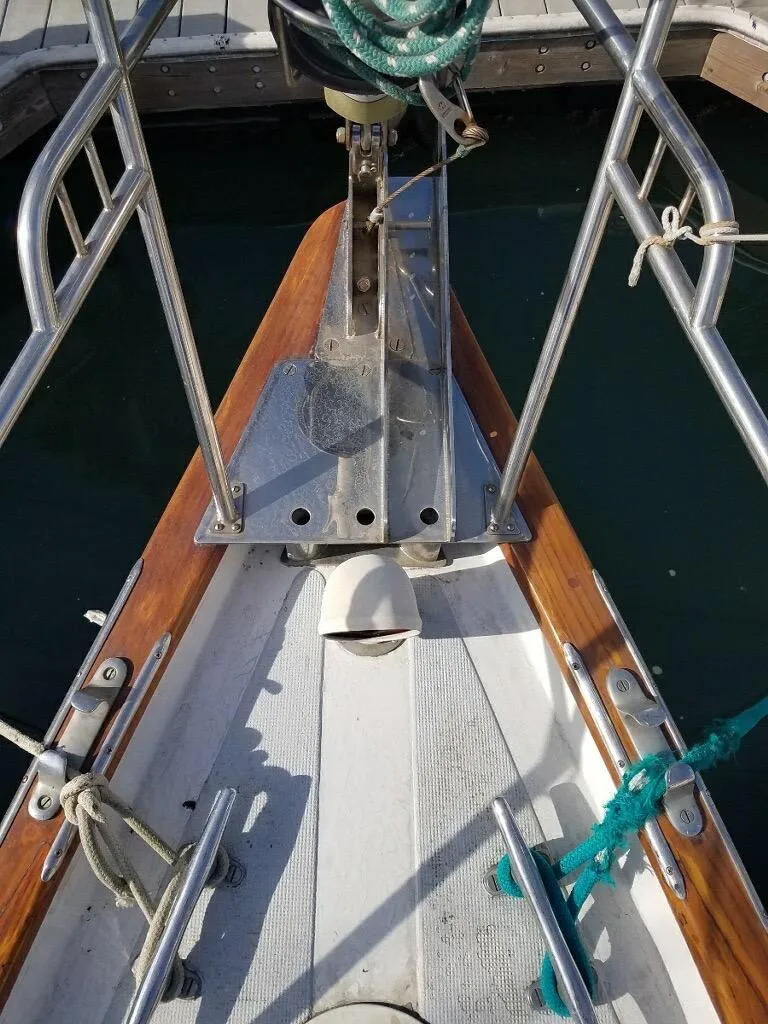 Slide: The Image of Bow of a 1967 Columbia Yacht 50 docked at a marina. - 7