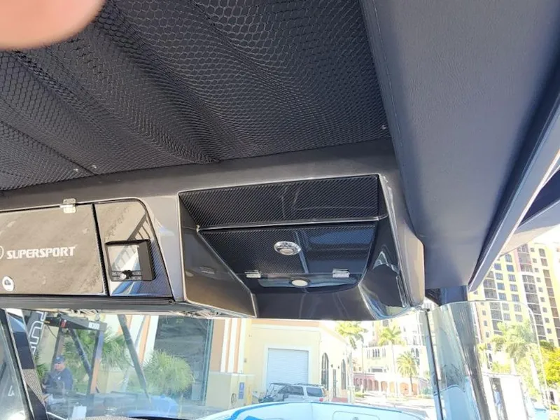 Slide: The Image of 2024 Nor-Tech 400 Supersport boat interior roof with storage compartments. - 10
