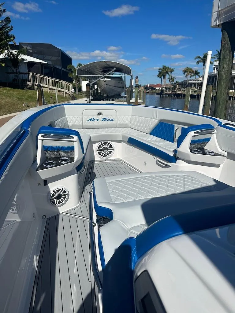 Slide: The Image of 2024 Nor-Tech 400 Supersport boat interior with luxurious seating and modern design. - 21