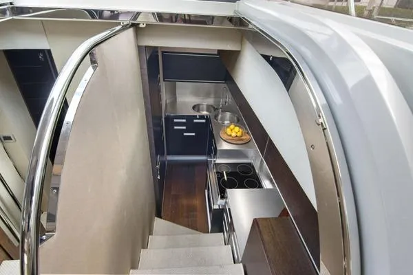 Slide: The Image of Modern kitchen interior of 2009 Azimut 68S yacht with sleek design and stainless steel appliances. - 10