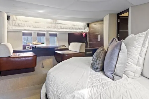 Slide: The Image of Luxurious interior of a 2009 Azimut 68S yacht with elegant bedding and seating. - 12