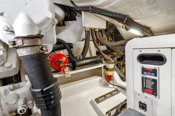 Slide: The Image of Engine room of 2009 Azimut 68S yacht, featuring mechanical components and safety equipment. - 17
