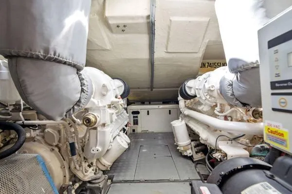 Slide: The Image of Engine room of 2009 Azimut 68S yacht, showcasing dual engines and mechanical components. - 18