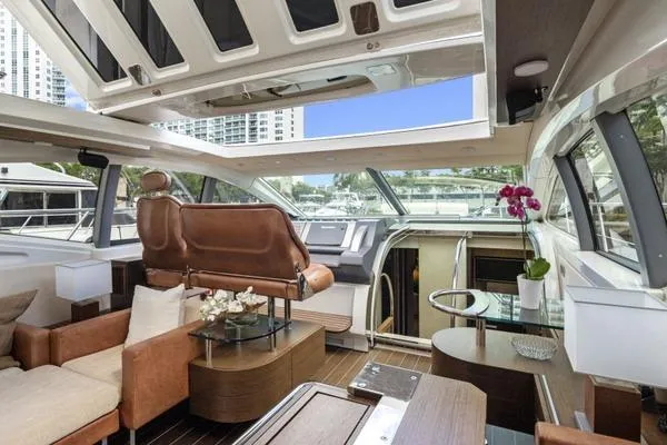 Slide: The Image of Luxurious interior of 2009 Azimut 68S yacht with modern furnishings and panoramic windows. - 5