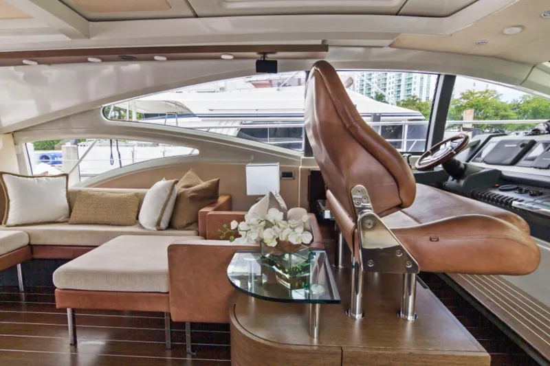 Slide: The Image of Luxurious interior of 2009 Azimut 68S yacht with plush seating and elegant decor. - 6
