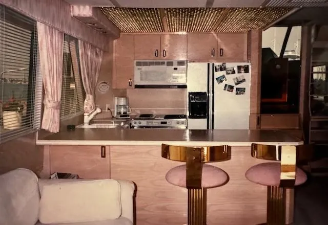 Slide: The Image of Interior of 1990 Motor Yacht 70 Brata with kitchen and bar stools. - 22