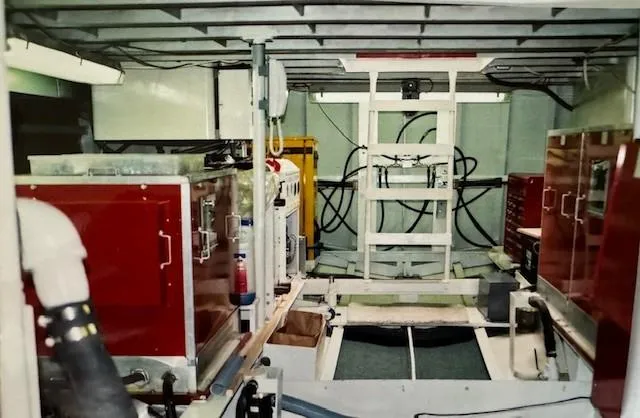 Slide: The Image of Engine room of 1990 Motor Yacht 70 Brata with red cabinets and equipment. - 25