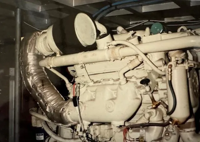 Slide: The Image of Engine of 1990 Motor Yacht 70 Brata, showcasing intricate mechanical components. - 28