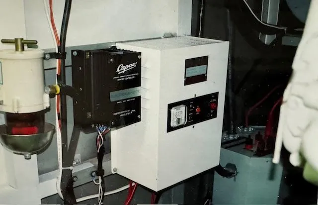 Slide: The Image of Electrical panel in 1990 Motor Yacht 70 Brata engine room, featuring control systems and wiring. - 30