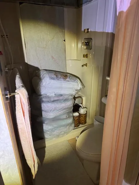 Slide: The Image of Bathroom in 1990 Motor Yacht 70 Brata with towels and toiletries. - 33