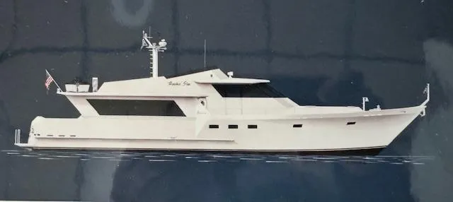 Slide: The Image of 1990 Motor Yacht 70 Brata, sleek design, cruising on calm waters. - 6