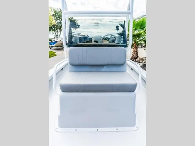 Slide: The Image of 2024 Majek Boats 18 M2 ILLUSION, featuring a sleek seating area and windshield. - 11