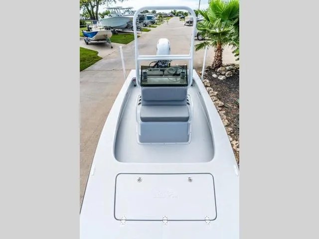 Slide: The Image of 2024 Majek Boats 18 M2 ILLUSION, sleek design, parked on a driveway with palm trees. - 12