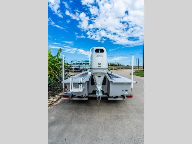 Slide: The Image of 2024 Majek Boats 18 M2 ILLUSION, rear view, parked on a sunny day. - 4