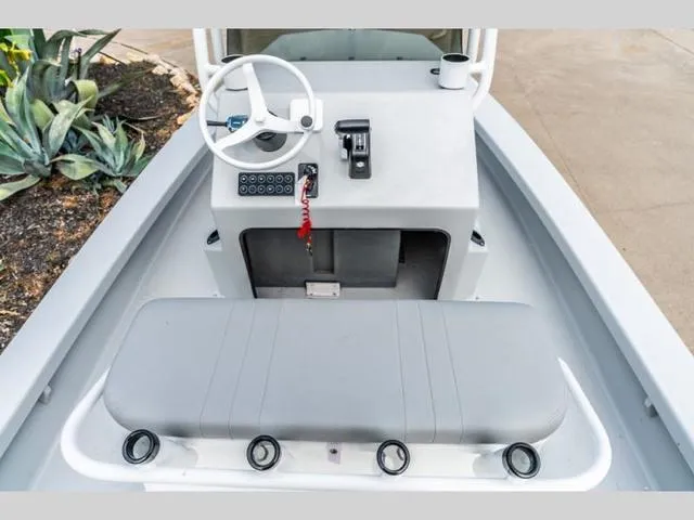 Slide: The Image of 2024 Majek Boats 18 M2 ILLUSION console with steering wheel and seating. - 7