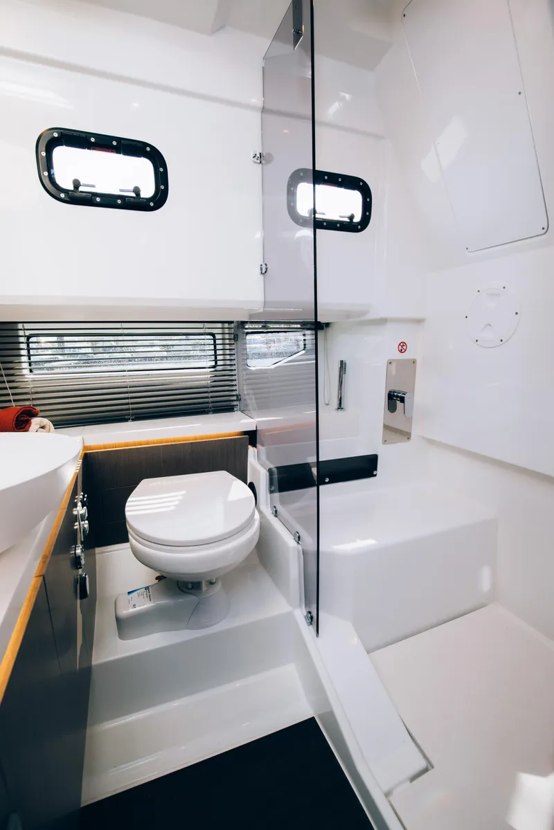 Slide: The Image of Modern bathroom in 2025 Wellcraft 38 Explorer yacht with sleek design and compact layout. - 8