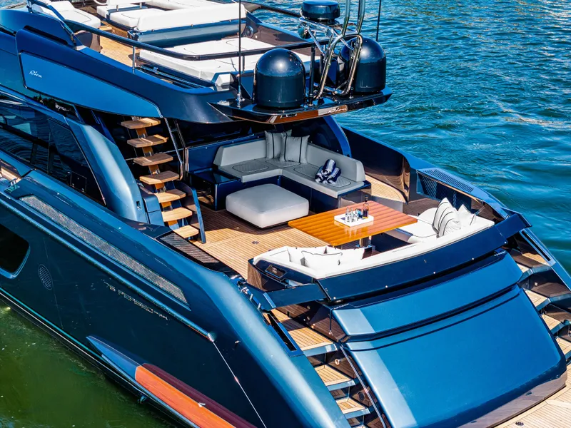 Slide: The Image of Luxurious 2025 Riva 76' Perseo Super yacht with elegant deck and seating area on water. - 8