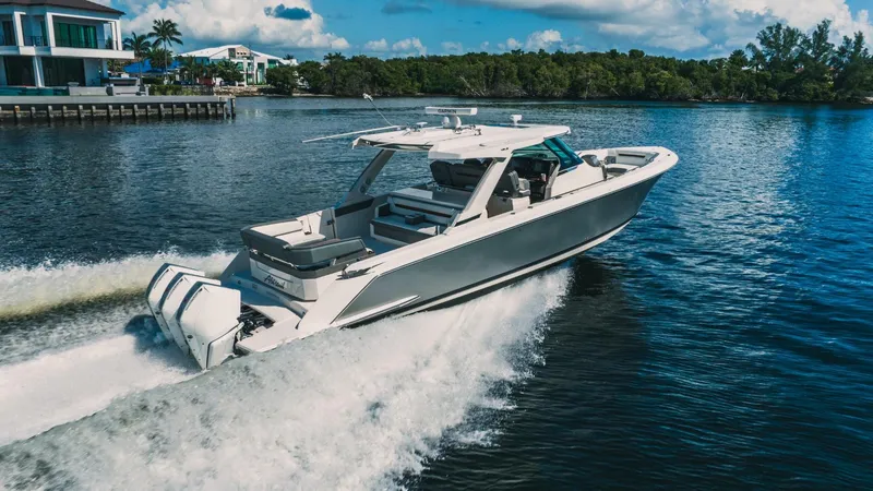 Slide: The Image of 2021 Tiara Sport 43 LS boat cruising on a sunny day. - 1