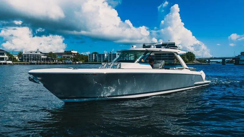 Slide: The Image of 2021 Tiara Sport 43 LS luxury boat cruising on a sunny day. - 10