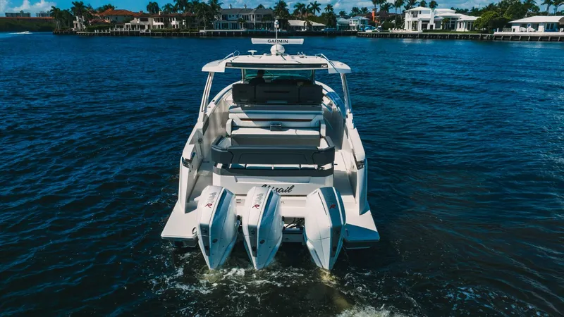 Slide: The Image of 2021 Tiara Sport 43 LS luxury boat cruising on water. - 13
