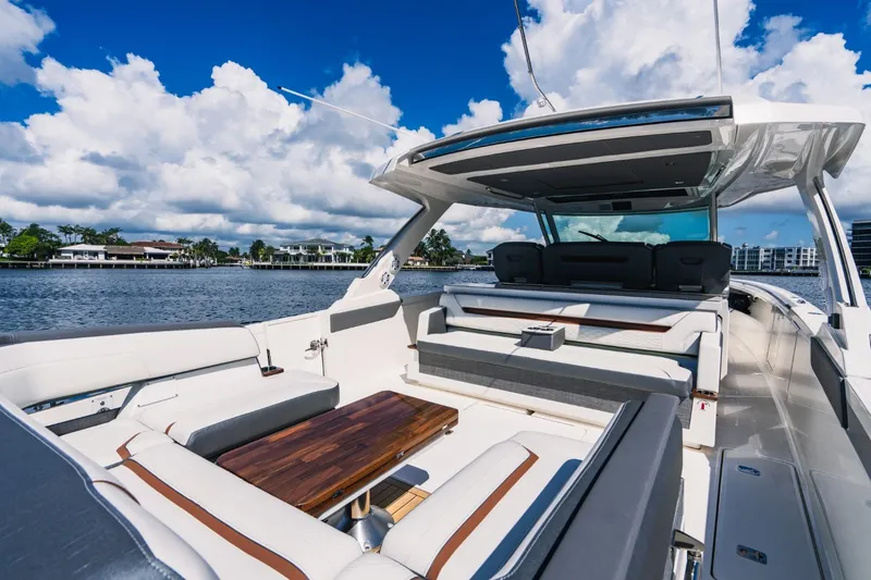 Slide: The Image of 2021 Tiara Sport 43 LS luxury yacht with spacious seating and scenic water view. - 21