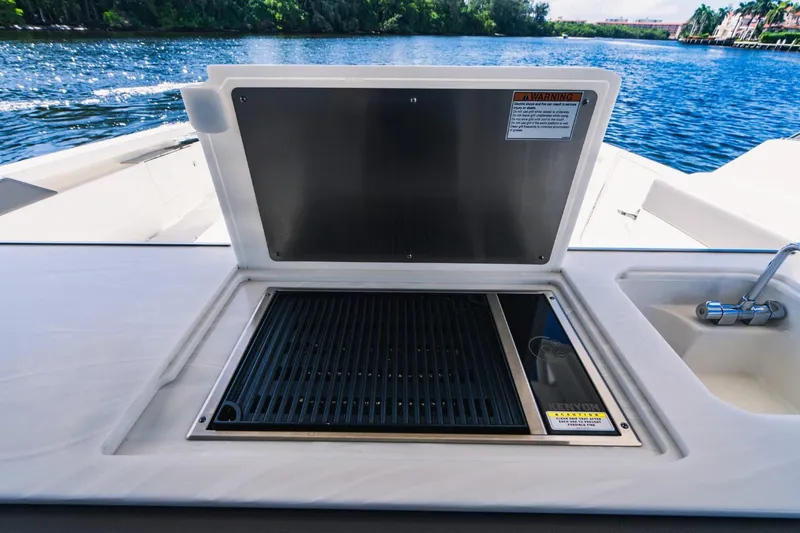 Slide: The Image of Outdoor grill and sink on the 2021 Tiara Sport 43 LS boat. - 28