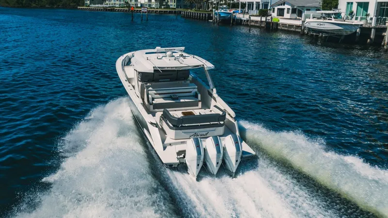 Slide: The Image of 2021 Tiara Sport 43 LS boat cruising on water. - 3