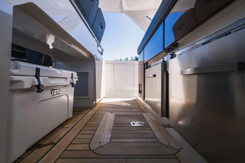Slide: The Image of Interior view of 2021 Tiara Sport 43 LS yacht with teak flooring and Yeti cooler. - 30