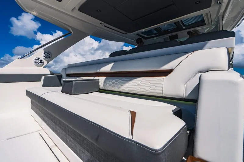 Slide: The Image of Luxury seating on 2021 Tiara Sport 43 LS yacht under blue sky. - 35