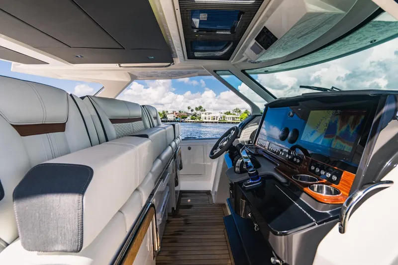 Slide: The Image of Interior cockpit of 2021 Tiara Sport 43 LS yacht with luxurious seating and advanced navigation system. - 37