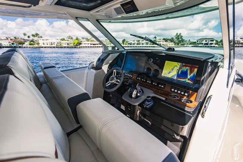 Slide: The Image of 2021 Tiara Sport 43 LS boat interior with advanced navigation system. - 38